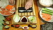 Closeup of rolling Sushi roll