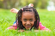 Outdoor portrait of a cute young black girl smiling - African pe