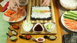 Making Sushi roll with salmon and avocado