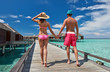 Couple on a beach jetty at Maldives