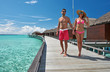Couple on a beach jetty at Maldives