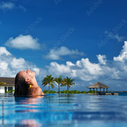 Photo: Woman at poolside Woman at poolside