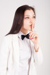 Beautiful woman gesturing to silence