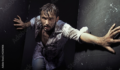 Photo: Handsome man wearing dirty clothes Handsome man wearing dirty clothes