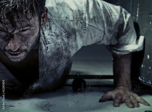 Photo: Dirty man trying to get up Dirty man trying to get up