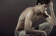 Muscular young athlete with perfect body