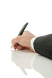 Photo: Back view of a hand writing Back view of a hand writing