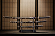 Katana, wakizashi and tanto on stand in a room