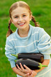 Photo: Vegetable - girl with eggplants (aubergine) in the garden Vegetable - girl with eggplants (aubergine) in the garden