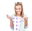 Surprised blond woman holding shopping bags