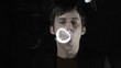 Man blowing smoke rings