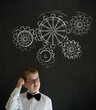 Scratching head boy dressed as business man chalk turning gears