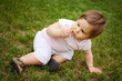 Portrait of beautiful baby girl on the lawn