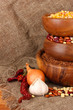 Raw corn,buckwheat and beans in wooden bowls