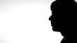 Man exhaling cigarette smoke silhouette