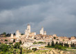 San Gimignano under cloudy sky.