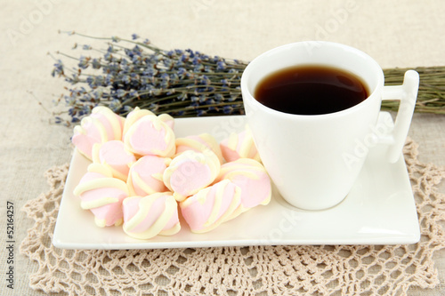 Photo: Marshmallows on plate on light background Marshmallows on plate on light background