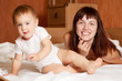 Photo: Happy mother with baby n interior Happy mother with baby n interior