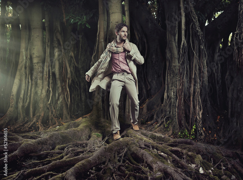 Photo: Elegant man on nature background Elegant man on nature background