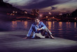 Smart man sitting close to the river