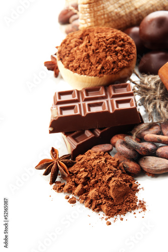 Photo: Composition of chocolate sweets, cocoa and spices, isolated Composition of chocolate sweets, cocoa and spices, isolated