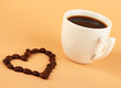 Cup of strong coffee on beige background