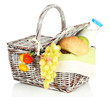 Picnic basket with fruits and bottle of milk, isolated on white
