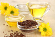 Useful linseed oil on wooden table close-up