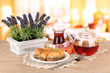 Sweet baklava on plate with tea on table in room