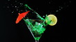 Ice falling into green cocktail