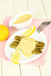 Asparagus on plate, on wooden background