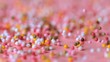 Sprinkles falling on pink surface