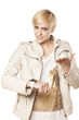 dissatisfied pretty girl  shows clock with questionable gestures