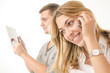 business couple using phone and tablet