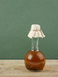 bottle with vegetable oil on a wooden table