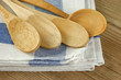 wooden kitchenware  and dishcloth on old wooden table