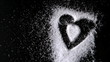 Heart design shaped out in sugar blowing away