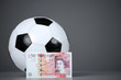 Fifty pounds sterling and soccer ball.