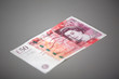 The Fifty pounds sterling. On a gray background