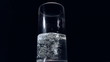 Low angle view of water pouring into glass