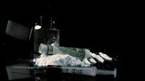 Vídeo: Rolled up dollar note falling on pile of white drug beside syringe and lighter Rolled up dollar note falling on pile of white drug beside syringe and lighter