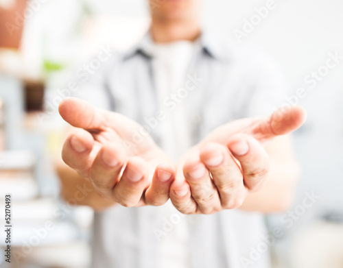 Photo: Man holding something in his hands Man holding something in his hands