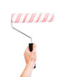 Hand holding roller brush isolated on white