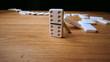 The domino effect on wooden table
