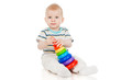 Photo: The little boy with a toy pyramid The little boy with a toy pyramid