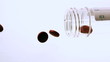Pills pouring out of jar