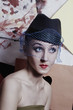 Foto: Young elegant woman in retro style Young elegant woman in retro style