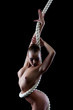 Photo: Portrait of flexible young model with rope Portrait of flexible young model with rope