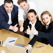 Successful business people are in a meeting show thumbs up