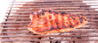 Flame broiled steak on a grill